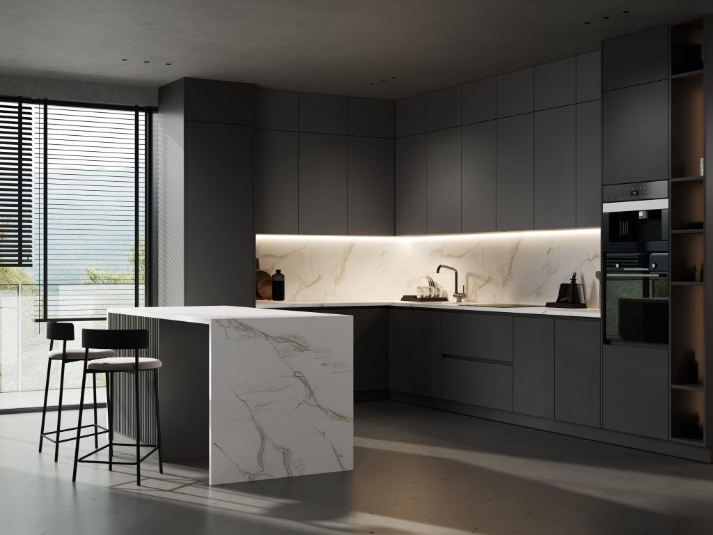 Dark kitchen counter with a gold-veined marble backsplash under warm lighting