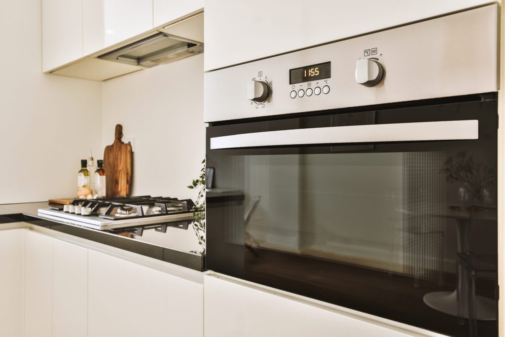 A gas hob beside a built-in oven — a dual fuel range is exactly this, two appliances in one