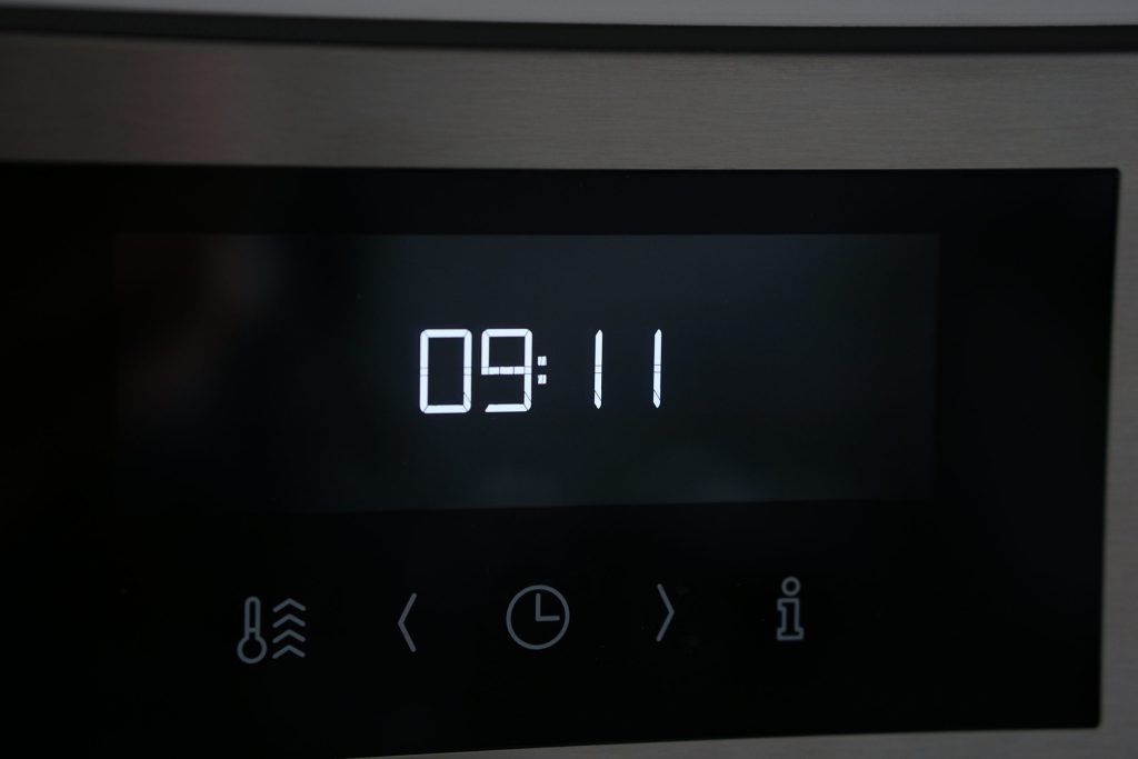 An appliance display showing the time and nothing else after a reset